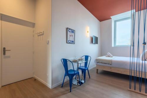 Ένα ή περισσότερα κρεβάτια σε δωμάτιο στο Studio équipé côté rue, parking gratuit