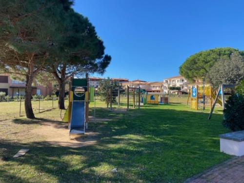 a park with a playground with a play equipment at Porto San Paolo a 50 mt dal mare in Porto San Paolo