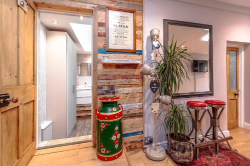 a room with two stools and a mirror at Bright Garden Flat, Private Sauna, Parking in Bristol