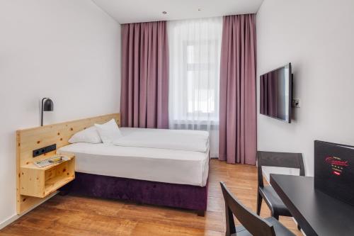 TV a/nebo společenská místnost v ubytování Hotel Central