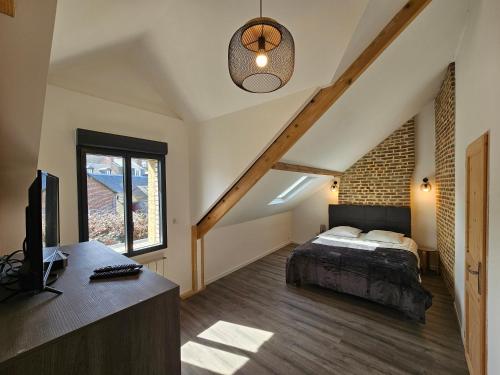 Postel nebo postele na pokoji v ubytování L'Etretataise, maison avec parking plein centre