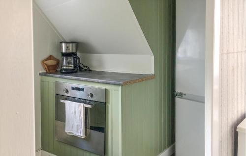 a kitchen with a stove with a counter top at 1 Bedroom Cozy Home In Vikbolandet in Arkösund