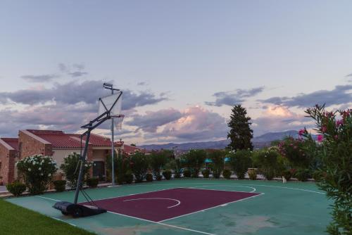a basketball court in front of a house at 99 Luxury Exotic Villas in Nafplio