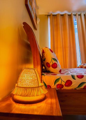 a bedroom with a bed and a table with a comb at Juhudi Homes - Makongo in Dar es Salaam