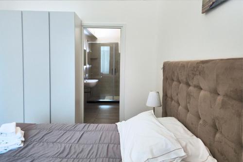 Postel nebo postele na pokoji v ubytování Home De Curtis