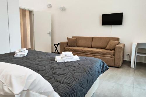 Postel nebo postele na pokoji v ubytování Home De Curtis