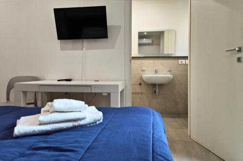 A bed or beds in a room at Home De Curtis