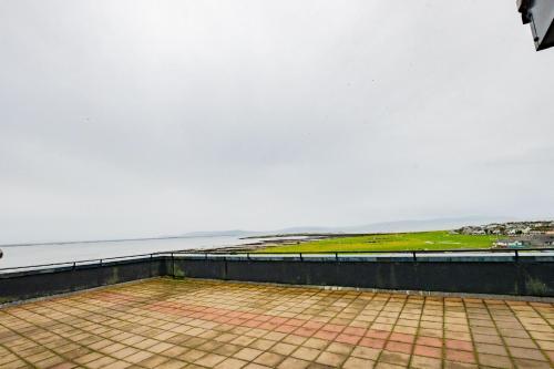 a view of the ocean from the top of a building at Dockside Penthouse - Free Parking in Galway