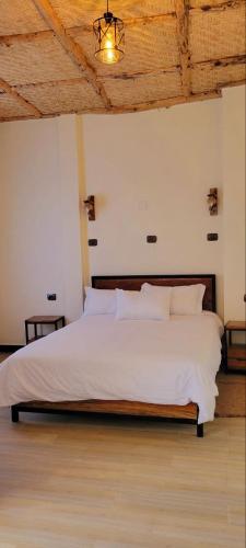 Ένα ή περισσότερα κρεβάτια σε δωμάτιο στο Lalibela Homestay