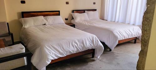 Ένα ή περισσότερα κρεβάτια σε δωμάτιο στο Lalibela Homestay