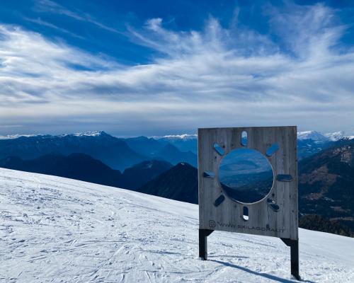 a sign on the top of a snow covered mountain at Elegante 1 Br, Bellavista in Valsugana, Trentino in Strigno