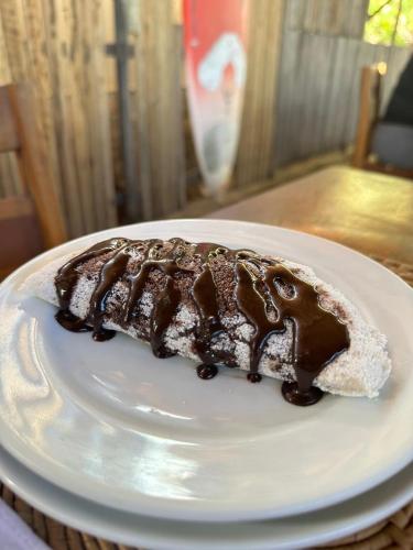 a piece of chocolate cake on a white plate at Mar de Jeri in Jericoacoara