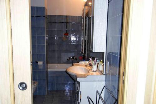 a bathroom with a sink and a shower at Appartamento Blu in Giulianova