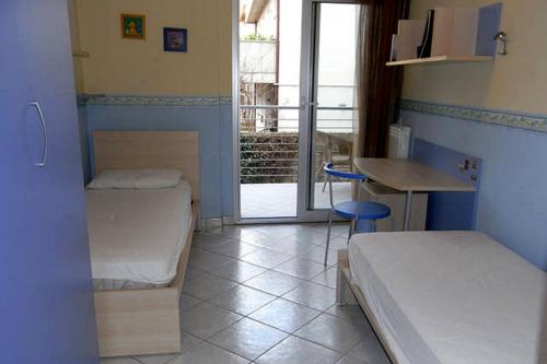 Un pat sau paturi într-o cameră la Appartamento Blu