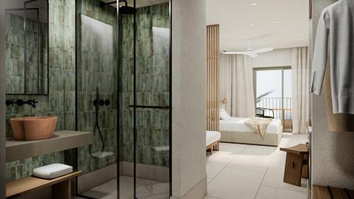 a bathroom with a shower and a bedroom at Cavo Marelia in Amoopi