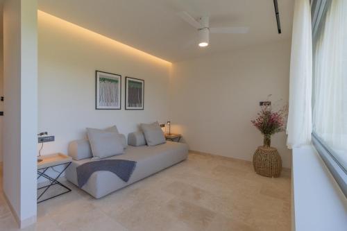 a living room with a couch and a table at Messinian Nest in Gialova
