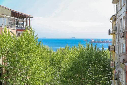 a view of the ocean from between buildings at ASİTANE life HOTEL in Istanbul