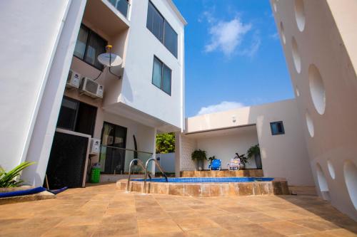 a view from the courtyard of a building with a swimming pool at Falcons Perch in Kumasi