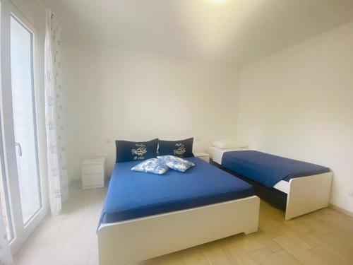 Letto o letti in una camera di B&B IL NIDO