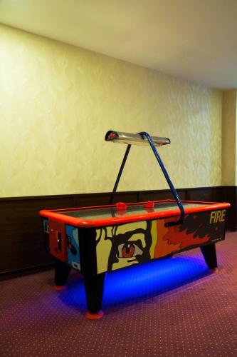 a ping pong table with a face painted on it at Hotel Lesana in Vysoké Tatry