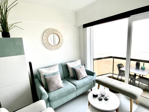 a living room with a couch and a table at Malibu Beach 9C in Blankenberge