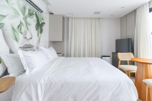 Ένα ή περισσότερα κρεβάτια σε δωμάτιο στο Up Hotel Boutique