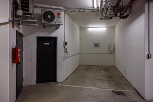 an empty hallway with a door in a room at Luxury Apartment Villach City in Villach