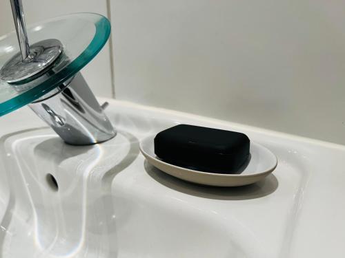a soap dish sitting on top of a sink at ARTvacanza Atelierhaus Edenkoben in Edenkoben