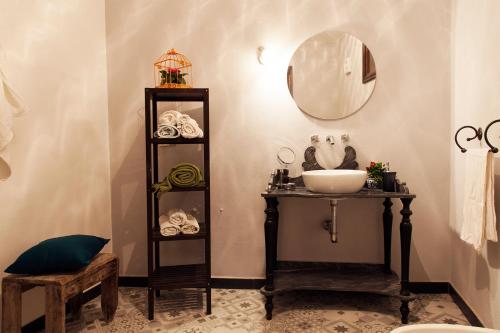 a bathroom with a sink and a mirror at Ca'Luni in Casola in Lunigiana