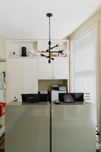 a kitchen with a large glass counter top at Hotel Roemer Amsterdam in Amsterdam