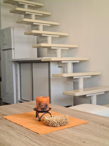 a table with a candle on top of a table at Duplex Family Apartment in Skopje