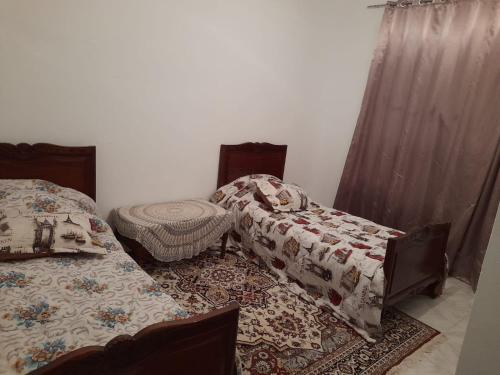 Ένα ή περισσότερα κρεβάτια σε δωμάτιο στο Hergla duplex charmant