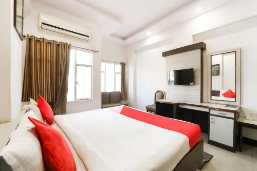 Ένα ή περισσότερα κρεβάτια σε δωμάτιο στο Super Hotel Utsav