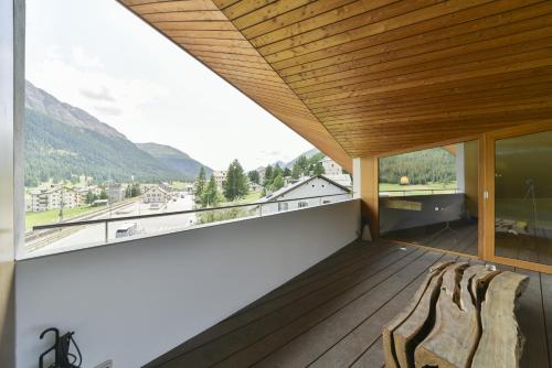 a balcony with a view of the mountains at Chesa Arpiglia - Zuoz in Zuoz
