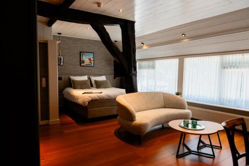 Postel nebo postele na pokoji v ubytování B&B Het Wellnest