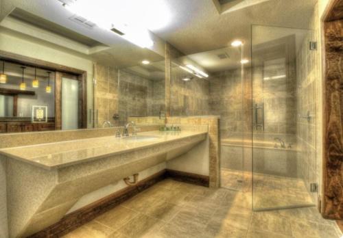 a large bathroom with two sinks and a shower at Sundance Club Resort in Gordon