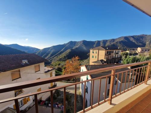 a balcony with a view of the mountains at Stella House in Uscio