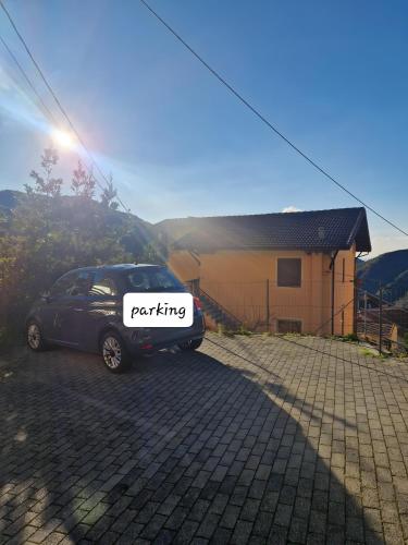 a car parked in front of a house at Stella House in Uscio
