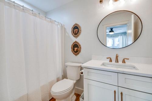 a bathroom with a toilet and a sink and a mirror at Newly Built Home with Mtn Views in Black Mountain! in Black Mountain