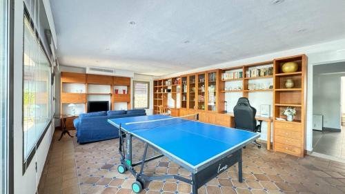 a living room with a ping pong table in it at Best Leisure in Playa de Palma in Can Pastilla