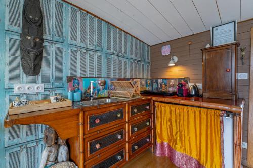 a kitchen with a sink and a wooden counter at Superbe Péniche En Centre Ville in Bordeaux