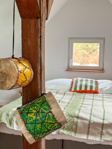 a bedroom with a bed and a window at Ferienhaus Burgi in Neckargemünd