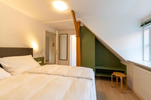 Postel nebo postele na pokoji v ubytování Kiwilodge