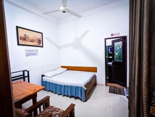 Postel nebo postele na pokoji v ubytování Hotel Change,Badulla