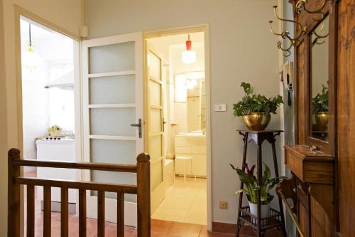 a hallway with a stairway leading to a bathroom at Casa Maria Vittoria in Cannero Riviera
