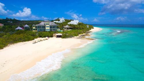 an aerial view of a resort on a beach at Blessed to Dream Villas in Long Bay Village