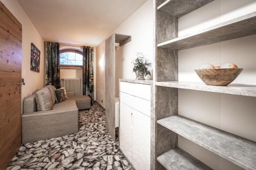 a hallway with stone flooring in a house at Brunnenhof Oberstdorf - Ferienwohnungen mit Hotel Service in Oberstdorf