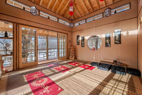 an empty room with red mats on the floor at Tranquility Redefined in the Heart of the Catskills in Jewett