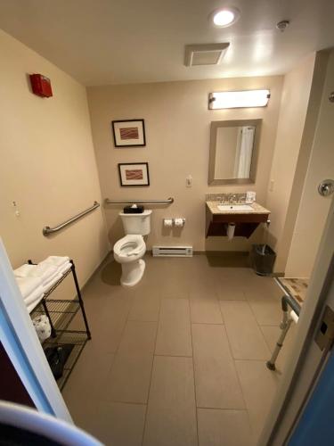 a bathroom with a toilet and a sink at Comfort Inn & Suites Brattleboro I-91 in Brattleboro