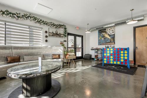 a living room with a couch and a table at First Floor Room With Chef's Kitchen And Pool in Pacific